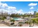 Luxurious outdoor pool area with comfortable lounge chairs, manicured landscaping and city skyline views at 401 E Robinson St # 202, Orlando, FL 32801