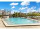 Relaxing outdoor pool with clear blue water and stunning views of the cityscape and blue skies with white puffy clouds at 401 E Robinson St # 202, Orlando, FL 32801