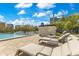Relax by the pool on comfortable lounge chairs and soak up the sun in this luxurious outdoor space with city views at 401 E Robinson St # 202, Orlando, FL 32801