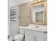 Bathroom featuring white tile, a single sink vanity, and updated fixtures at 4207 Chateau Rd, Orlando, FL 32808
