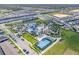 Aerial view showing the community's pool, basketball court, amenity center, and surrounding homes at 4353 Lana Ave, Davenport, FL 33897