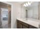 Bathroom with a large mirror, modern lighting, and great tile flooring at 4353 Lana Ave, Davenport, FL 33897
