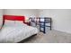 Bedroom featuring a bed, bunk bed, a side table, and neutral decor at 4353 Lana Ave, Davenport, FL 33897