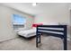 Bedroom featuring a bunk bed, large window, and neutral decor at 4353 Lana Ave, Davenport, FL 33897