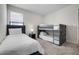 Bedroom featuring two beds, neutral paint, a window, and soft carpet at 4353 Lana Ave, Davenport, FL 33897