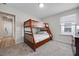 Bedroom featuring bunk beds, neutral paint, a window, and soft carpet at 4353 Lana Ave, Davenport, FL 33897