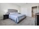 Beautiful bedroom featuring neutral colors, an upholstered headboard, carpet, and closet at 4353 Lana Ave, Davenport, FL 33897