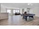 Bright game room featuring a pool table, light grey flooring, and lots of natural light at 4353 Lana Ave, Davenport, FL 33897