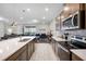 Modern kitchen with stainless steel appliances, ample counter space, and an open layout to living spaces at 4353 Lana Ave, Davenport, FL 33897