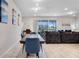 Spacious living room and dining area featuring modern decor, tile flooring, and natural light at 4353 Lana Ave, Davenport, FL 33897