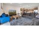 Open-concept living room adjoining kitchen, featuring comfortable seating and modern decor at 4353 Lana Ave, Davenport, FL 33897