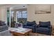 Bright living room with sliding glass doors to the outdoor patio and pool at 4353 Lana Ave, Davenport, FL 33897