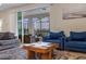Bright living room with sliding glass doors to the outdoor patio and pool at 4353 Lana Ave, Davenport, FL 33897