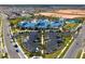 A high angle shot highlights the community's pool, clubhouse, parking, and meticulously manicured landscaping at 4353 Lana Ave, Davenport, FL 33897