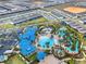 Overhead shot showcasing the community's pool area with a lazy river and fun water features at 4353 Lana Ave, Davenport, FL 33897