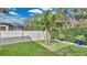 Secluded backyard featuring manicured lawn, white fence, and tasteful landscaping for relaxed outdoor living at 4419 Liberty Bell Cv, Orlando, FL 32817