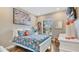 Bright bedroom with natural light, stylish décor, and wood-look tile flooring for a modern feel at 4419 Liberty Bell Cv, Orlando, FL 32817