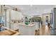 Spacious kitchen with double islands and white cabinetry, flowing into the living area at 4419 Liberty Bell Cv, Orlando, FL 32817