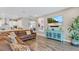 Open-concept living area with stylish furnishings and view into the kitchen at 4419 Liberty Bell Cv, Orlando, FL 32817
