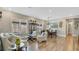 Elegant living and dining area featuring wood-look tile floors and lots of natural light at 4419 Liberty Bell Cv, Orlando, FL 32817