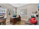 Functional home office with a large desk, comfortable seating, and natural light at 4419 Liberty Bell Cv, Orlando, FL 32817
