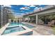 Inviting screened-in pool area with a pool, a spa, comfortable seating, and a well-maintained lanai at 4419 Liberty Bell Cv, Orlando, FL 32817