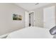 Bedroom with a large bed, neutral walls and a TV mounted on the wall provides a relaxing getaway at 480 Burma St, Kissimmee, FL 34747