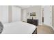 Bedroom featuring a bed with dark wood floors, closet and TV for immersive entertainment at 480 Burma St, Kissimmee, FL 34747