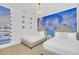 Themed bedroom featuring two beds, chandelier and Frozen mural offers a playful and magical sleeping space at 480 Burma St, Kissimmee, FL 34747