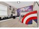 Themed bedroom with custom bunk beds, city skyline and Avengers mural offers a fun and imaginative space at 480 Burma St, Kissimmee, FL 34747