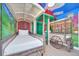 Themed room offering custom wagon-style beds, muraled walls, and a painted sky ceiling at 480 Burma St, Kissimmee, FL 34747