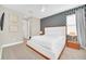 Primary bedroom with statement wall and side tables at 480 Burma St, Kissimmee, FL 34747