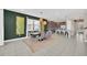 Dining room with seating for eight and pendant lights at 480 Burma St, Kissimmee, FL 34747