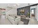 Open-concept living room with contemporary design and comfortable seating area at 480 Burma St, Kissimmee, FL 34747