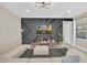 Modern living room with decorative wall, stylish light fixture, and comfortable sectional sofa at 480 Burma St, Kissimmee, FL 34747