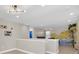 Bright and airy upstairs loft area, with a unique ceiling fan and light fixture at 480 Burma St, Kissimmee, FL 34747