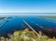 Aerial view showcasing multiple wooden piers extending into the tranquil lake at 4933 Raylene Way, St Cloud, FL 34771