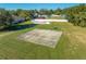 Aerial view of a community basketball court on a lush green lawn at 4933 Raylene Way, St Cloud, FL 34771