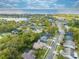 Aerial view of the property, neighborhood, lake, and the beautiful surrounding landscape at 4933 Raylene Way, St Cloud, FL 34771