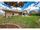 Grassy backyard featuring meticulous landscaping and an enclosed patio, blending indoor/outdoor living seamlessly at 4933 Raylene Way, St Cloud, FL 34771
