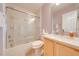 Bathroom features a shower-tub combination, a vanity, and neutral walls at 4933 Raylene Way, St Cloud, FL 34771