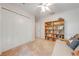 Bedroom with large closet, built-in shelves, and neutral carpet at 4933 Raylene Way, St Cloud, FL 34771