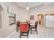 Charming dining area with tile flooring, arched entryway, and abundant natural light at 4933 Raylene Way, St Cloud, FL 34771