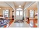 Inviting home foyer featuring tile flooring, a decorative light fixture, and views into other living spaces at 4933 Raylene Way, St Cloud, FL 34771