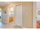 Hallway with a closet that leads to a bathroom with a vanity and mirror at 4933 Raylene Way, St Cloud, FL 34771