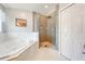 Stylish bathroom showcasing a soaking tub, glass shower, and contemporary design at 4933 Raylene Way, St Cloud, FL 34771
