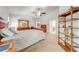 Bright main bedroom featuring neutral tones, a ceiling fan, and ample closet space at 4933 Raylene Way, St Cloud, FL 34771
