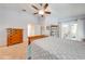 Inviting bedroom featuring a ceiling fan, wood furniture, and plenty of natural light at 4933 Raylene Way, St Cloud, FL 34771