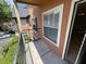 A balcony overlooking a landscaped yard at 5959 Westgate Dr # 1526, Orlando, FL 32835