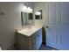 Bathroom featuring a white vanity with undermount sink, framed mirror, and modern lighting at 5959 Westgate Dr # 1526, Orlando, FL 32835